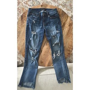 EXPRESS medium wash mid rise ripped jeans